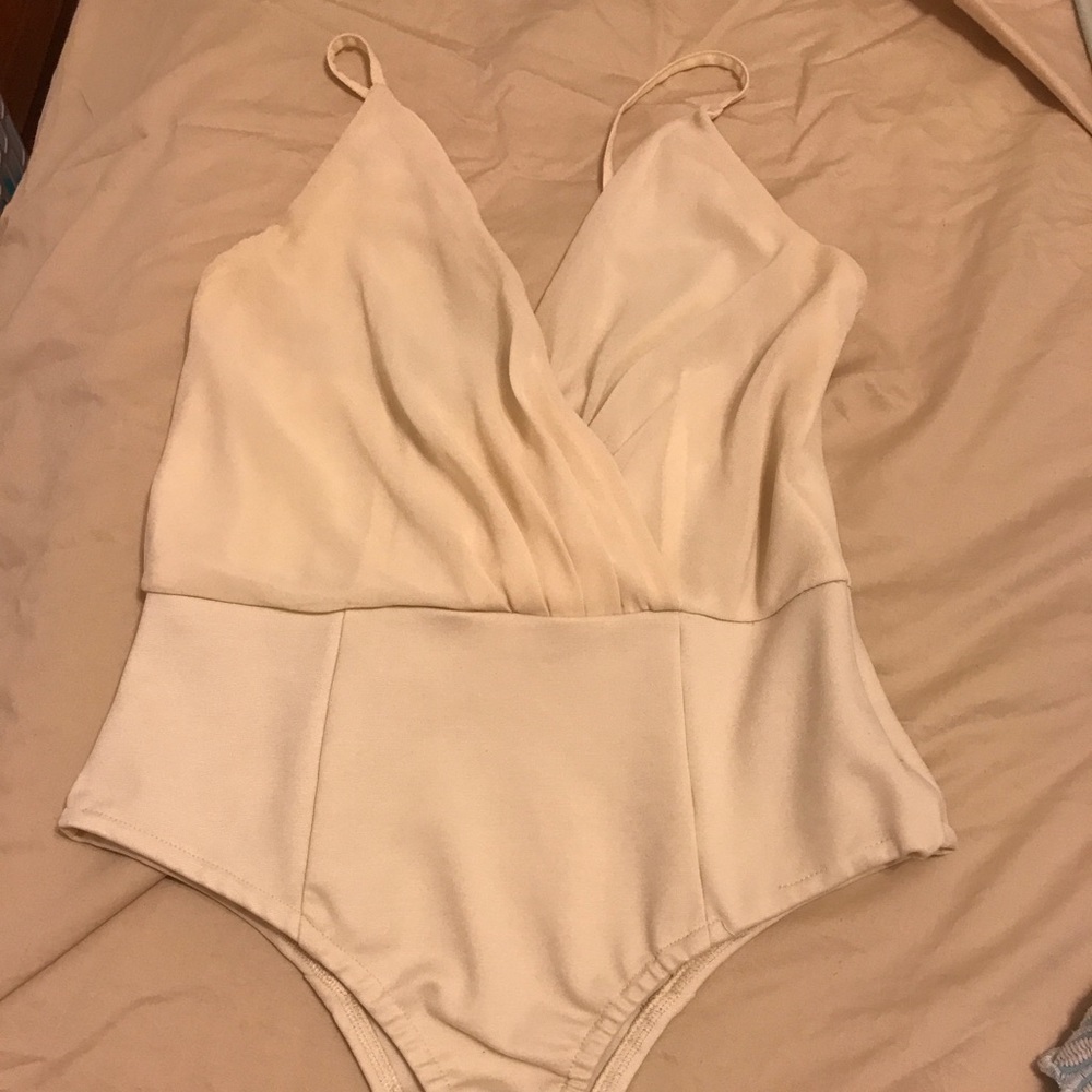 Light weight cream body suit. Perfect for summer.
